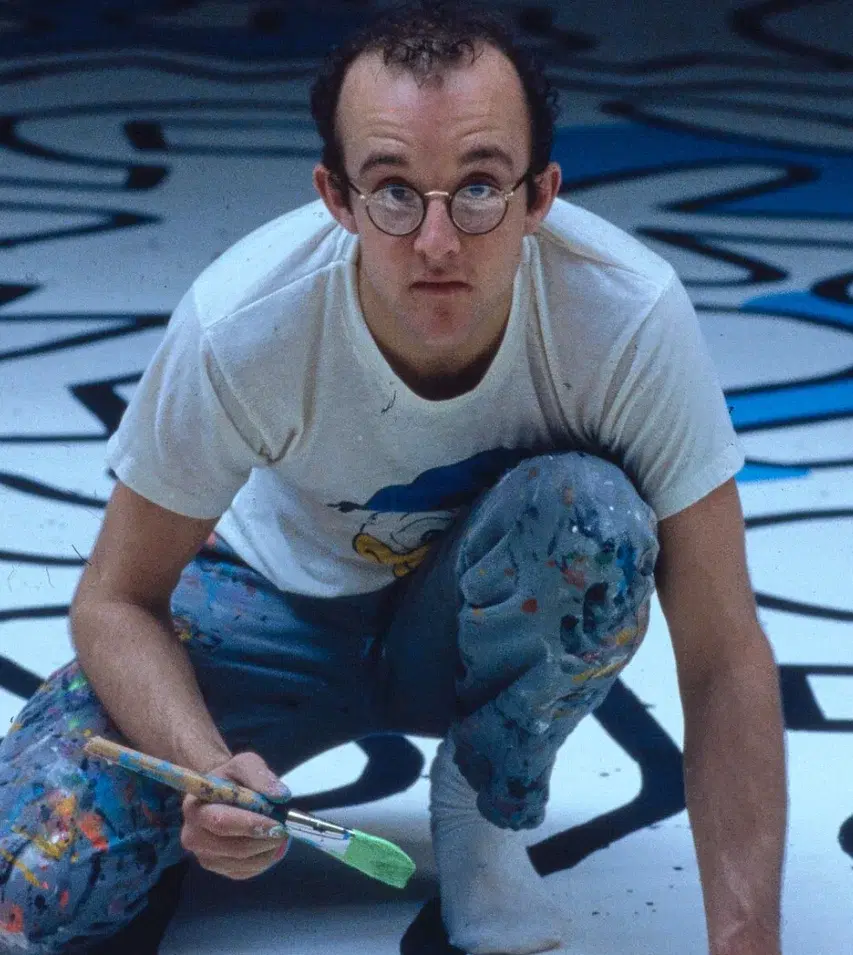 Keith Haring, painting Palladium backdrop [Palladium night club, New York City]